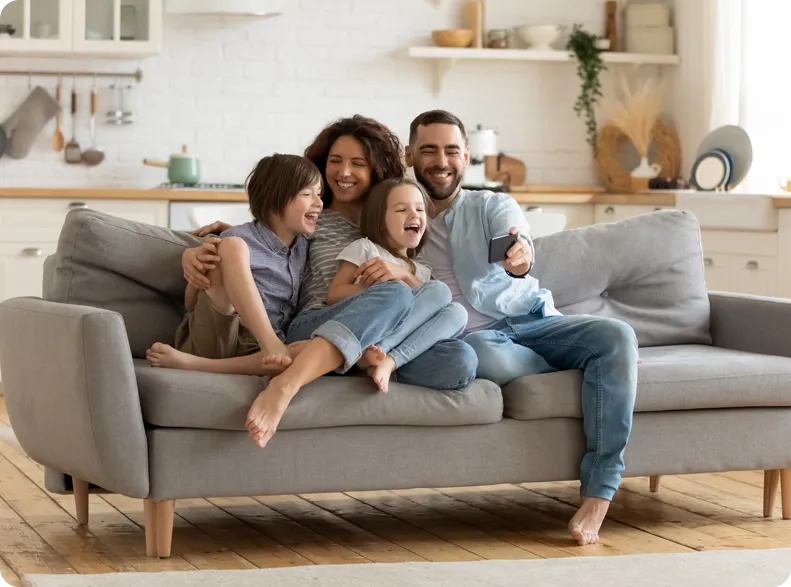 A family sitting together enjoying the indoors.