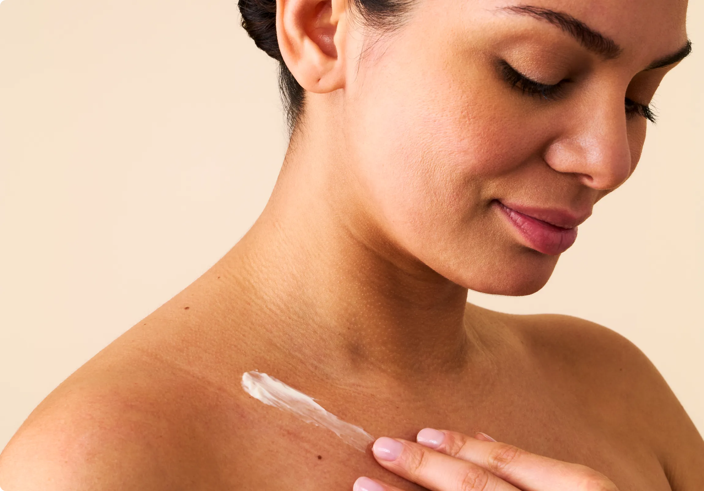 Close-up of a woman's elbow, displaying signs of dryness. 
