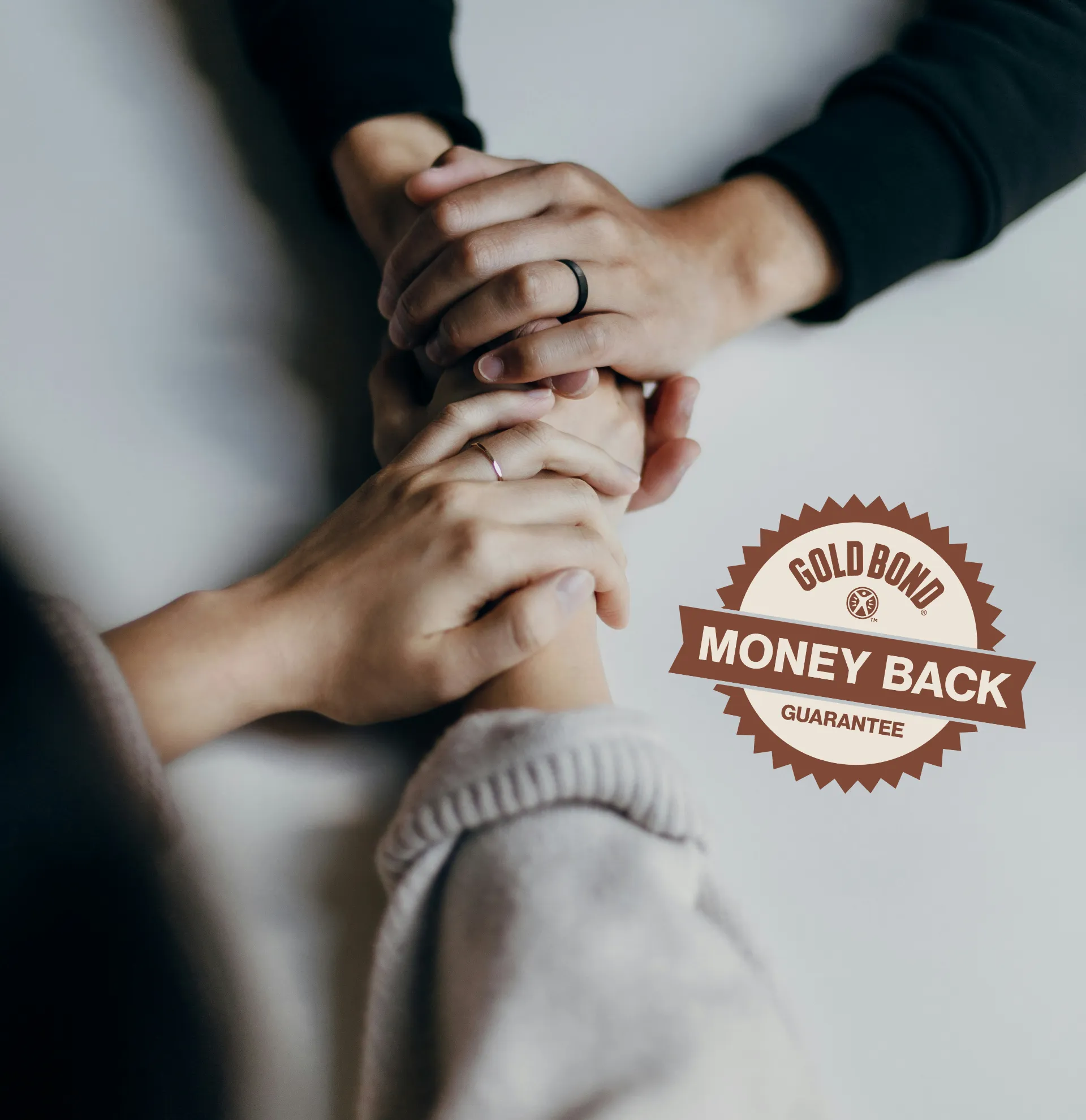 A hand squeezing Gold Bond Age Renew Crepe Corrector Body Lotion, with visible white cream on the other hand. The interior left side features a seal reading 'Gold Bond Money Back Guarantee